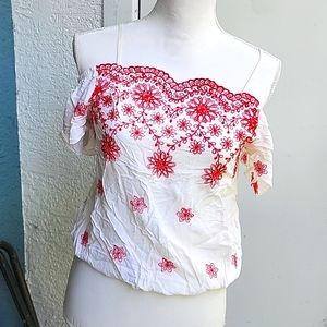 Blood orange and cream colored off shoulder top